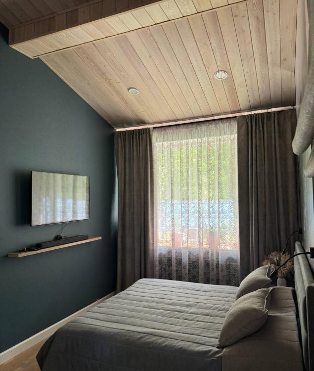 Мастер-спальня в загородном доме в Ахунах